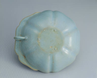 Hibiscus-shaped cup with ear handle in sky-blue glaze