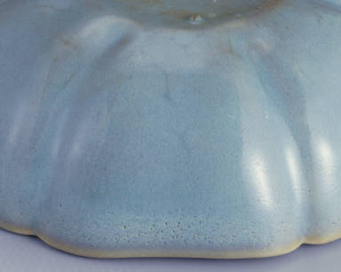 Hibiscus-shaped cup with ear handle in sky-blue glaze
