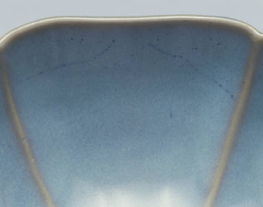 Hibiscus-shaped cup with ear handle in sky-blue glaze