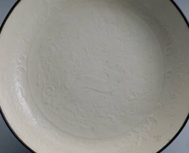 Dish impressed with deer design in white glaze