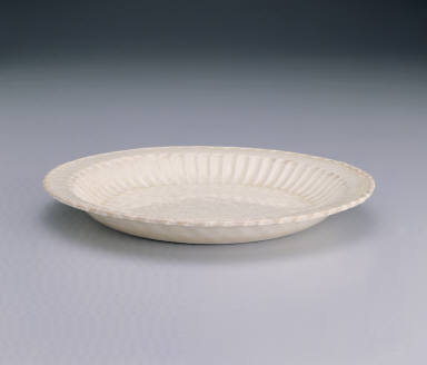 Dish with impressed design of peonies and pleated rim in white glaze