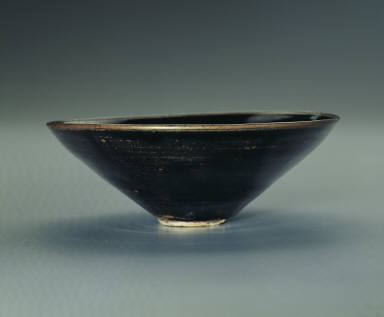 Black glazed bowl with leaf pattern
