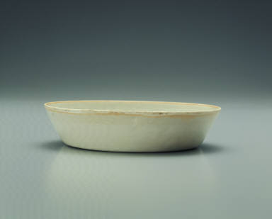 Pale bluish-green glazed bowl with impressed floral design