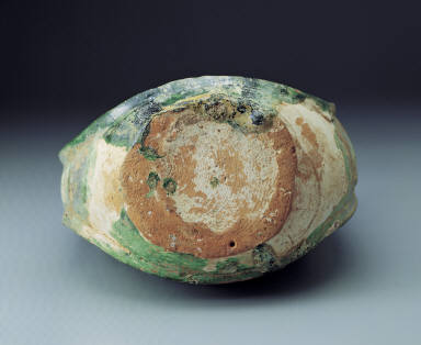 Green-glazed ewer in the shape of a leather pouch