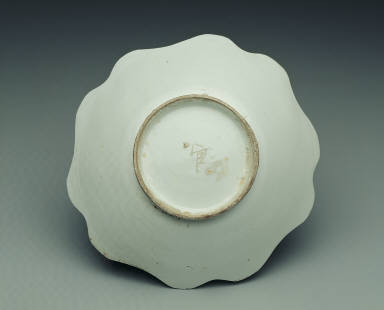 White-glazed bowl with floral rim and Guan mark