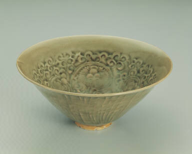 Bowl with impressed chrysanthemum design in yellowish-green glaze
