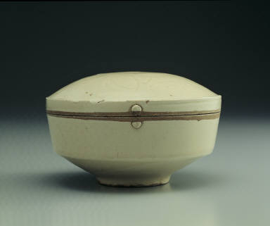 Box with incised day lily design in white glaze