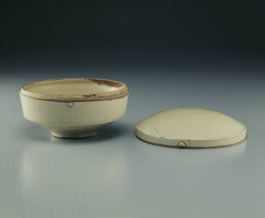 Box with incised day lily design in white glaze