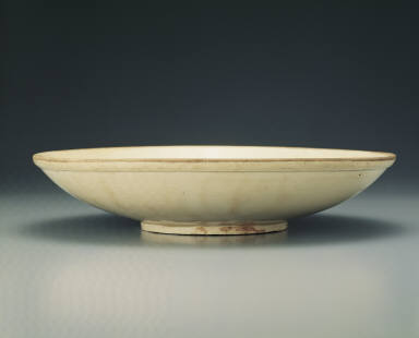Large dish with incised dragon design in white glaze