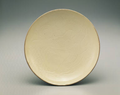 Large dish with incised dragon design in white glaze