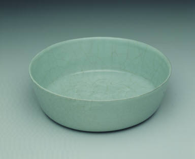 Basin with impressed dragon design in light bluish-green glaze