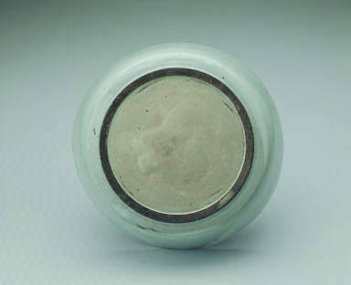 Basin with impressed dragon design in light bluish-green glaze