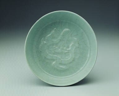 Basin with impressed dragon design in light bluish-green glaze