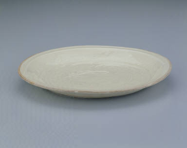 Plate with impressed design of a dancing phoenix in white glaze