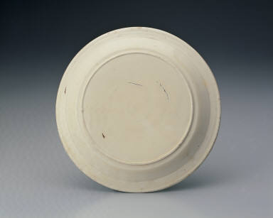 Plate with impressed design of a dancing phoenix in white glaze