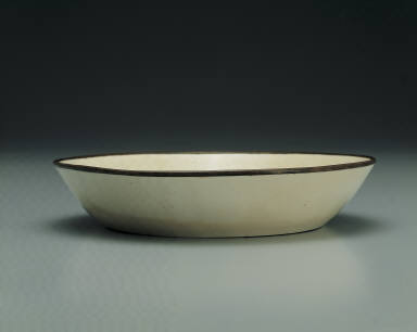 Dish with impressed motif of six chi dragons in white glaze