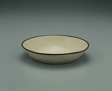 Dish with impressed motif of six chi dragons in white glaze