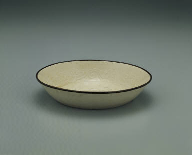 Dish with impressed motif of six chi dragons in white glaze