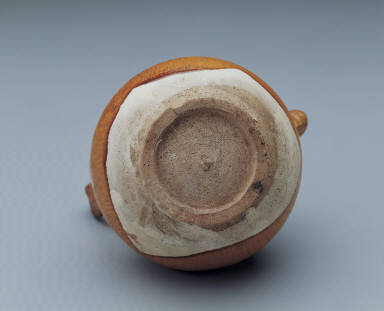 Yellow-glazed pitcher in the shape of a gourd