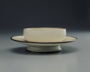 Saucer with incised lotus design in whtie glaze