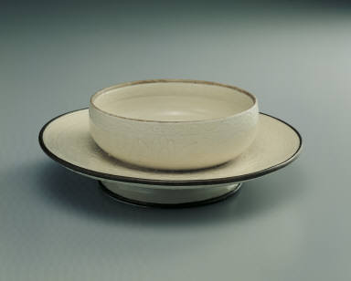 Saucer with incised lotus design in whtie glaze