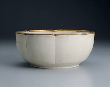Warming bowl with incised floral design in white glaze