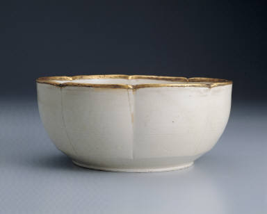 Warming bowl with incised floral design in white glaze
