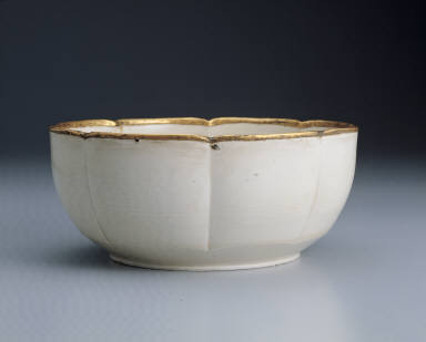 Warming bowl with incised floral design in white glaze