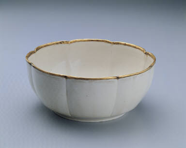 Warming bowl with incised floral design in white glaze