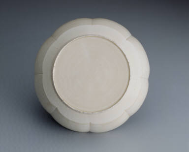 Warming bowl with incised floral design in white glaze