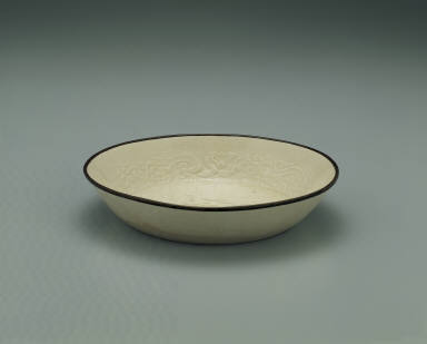 Dish with impressed motif of six chi dragons in white glaze