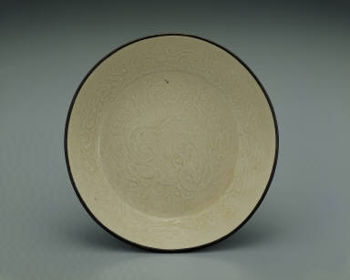 Dish with impressed motif of six chi dragons in white glaze