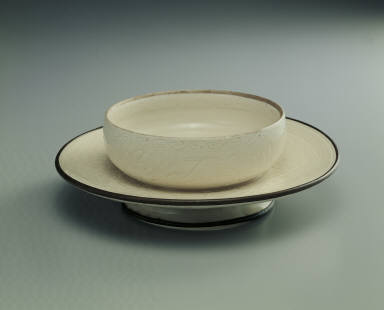Saucer with incised lotus design in whtie glaze