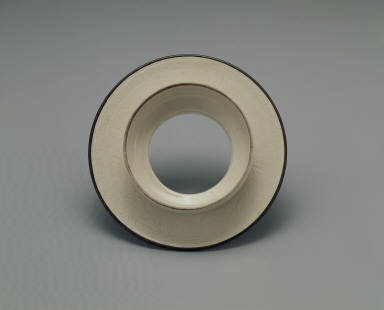 Saucer with incised lotus design in whtie glaze