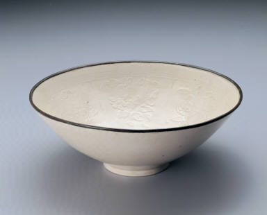 Bowl impressed with flowers of the four seasons in white glaze