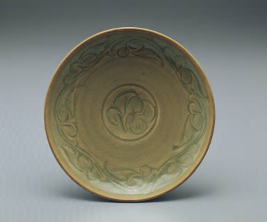 Dish with incised design in yellowish green glaze