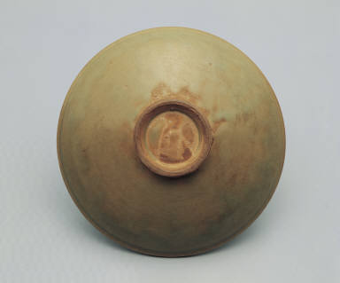 Dish with incised design in yellowish green glaze