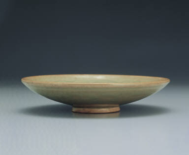 Dish with incised design in yellowish green glaze