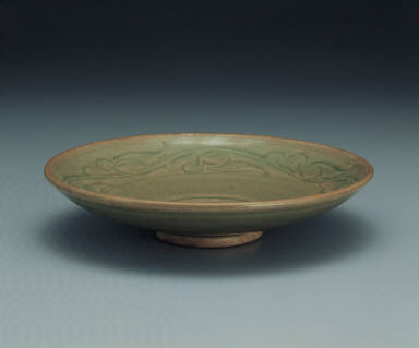 Dish with incised design in yellowish green glaze