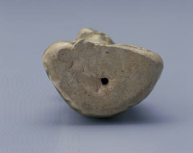 Figurine of a young girl in yellowish-green glaze