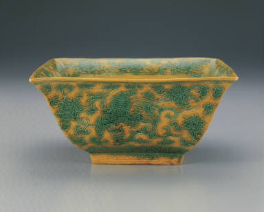 Square brush washer with incised phoenix design in green and bright yellow enamels