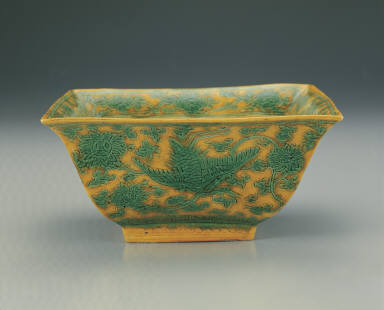 Square brush washer with incised phoenix design in green and bright yellow enamels