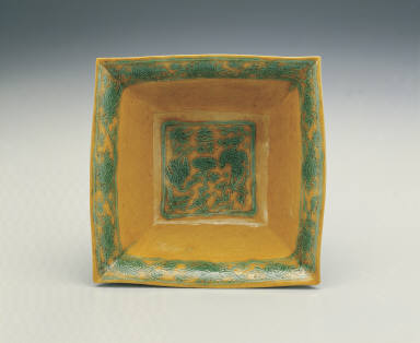 Square brush washer with incised phoenix design in green and bright yellow enamels
