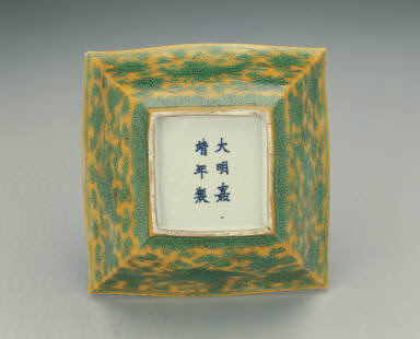 Square brush washer with incised phoenix design in green and bright yellow enamels