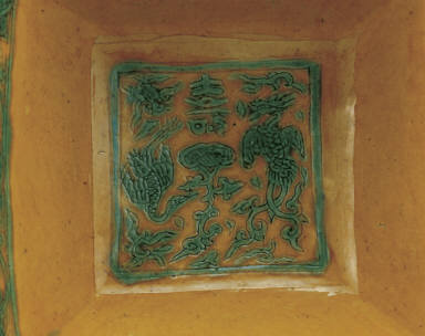 Square brush washer with incised phoenix design in green and bright yellow enamels