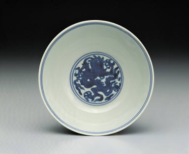 Bowl with dragons chasing pearls in underglaze blue on a yellow ground