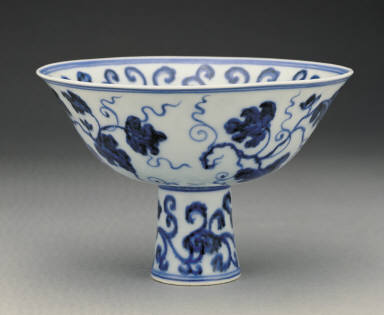 Stem bowl with design of fungus and grapes in undergraze blue