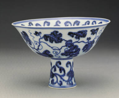 Stem bowl with design of fungus and grapes in undergraze blue