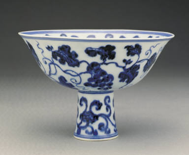 Stem bowl with design of fungus and grapes in undergraze blue