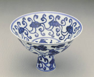 Stem bowl with design of fungus and grapes in undergraze blue